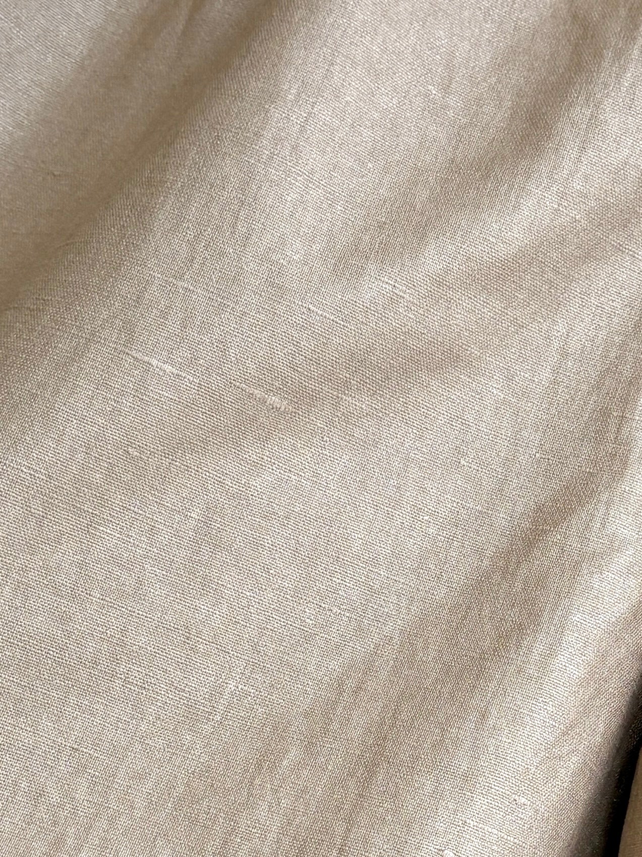 A close up of the gold fabric