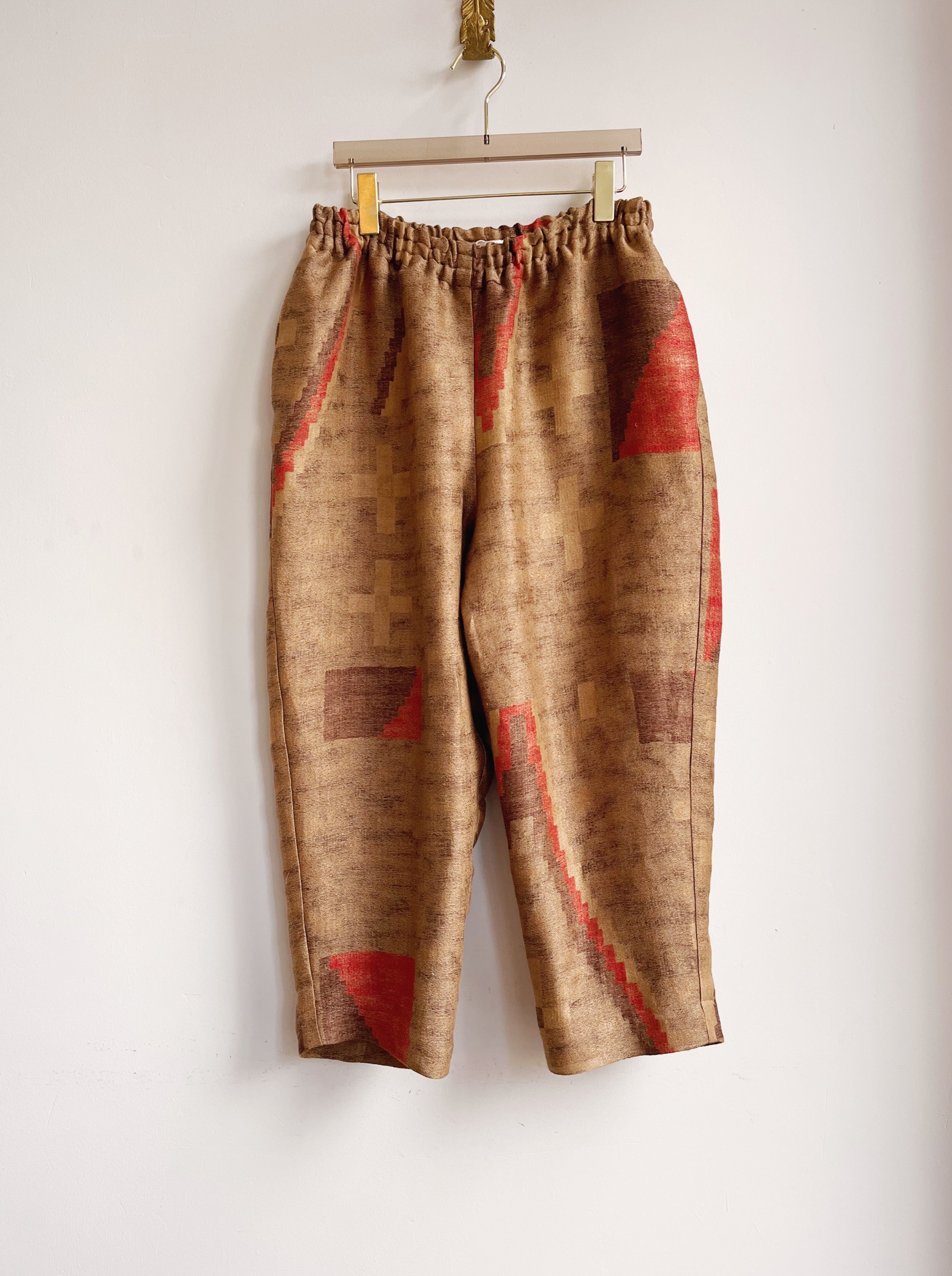 Image of jogger-style pants in orange and brown Santa Fe linen weave