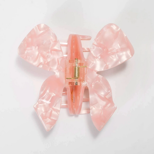 pink bow claw clip | baby pink claw clip shaped like a bow | butterfly claw clip