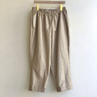 Image of cropped jogger-style pant in gold waxed cotton