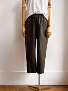 Image of cropper jogger-style pants in olive army green cotton canvas on mannequin