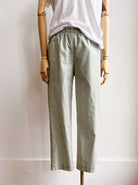 Image of sage printed cotton jogger-style pants on mannequin